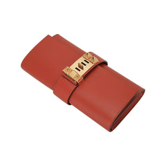 Medor 23 Clutch Bag Brique Tadelakt Leather with Gold Hardware